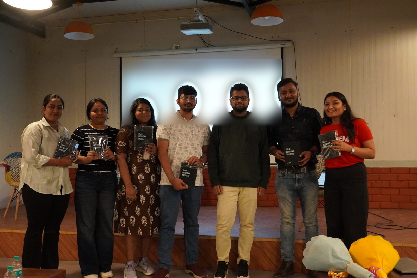 Participants of the Agentic AI hackathon holding Masai notebooks