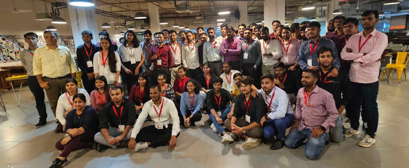 A hiring day at Masai with a large group of learners wearing red lanyards